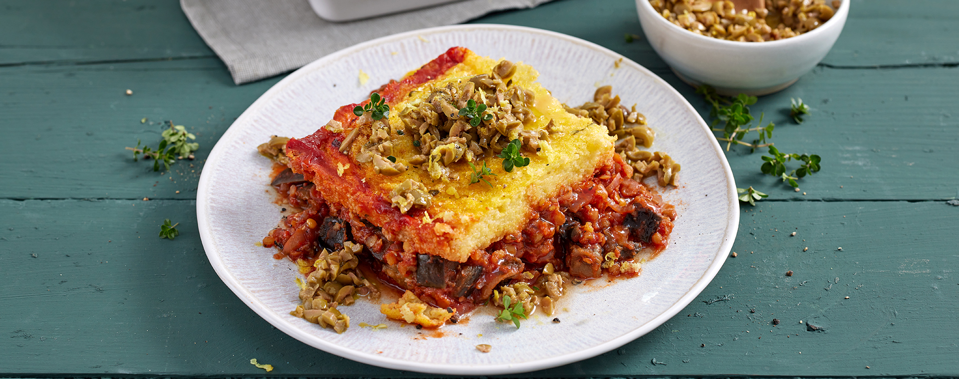 4 25 Auberginen Linsen Auflauf Mit Polentahaube 1920x760px